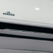 Primer plano de una unidad interna de aire acondicionado Horizon con indicador digital de temperatura.